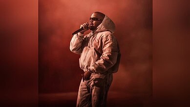 Kanye West on stage during his first-ever performance in India, showcasing his iconic style and musi.