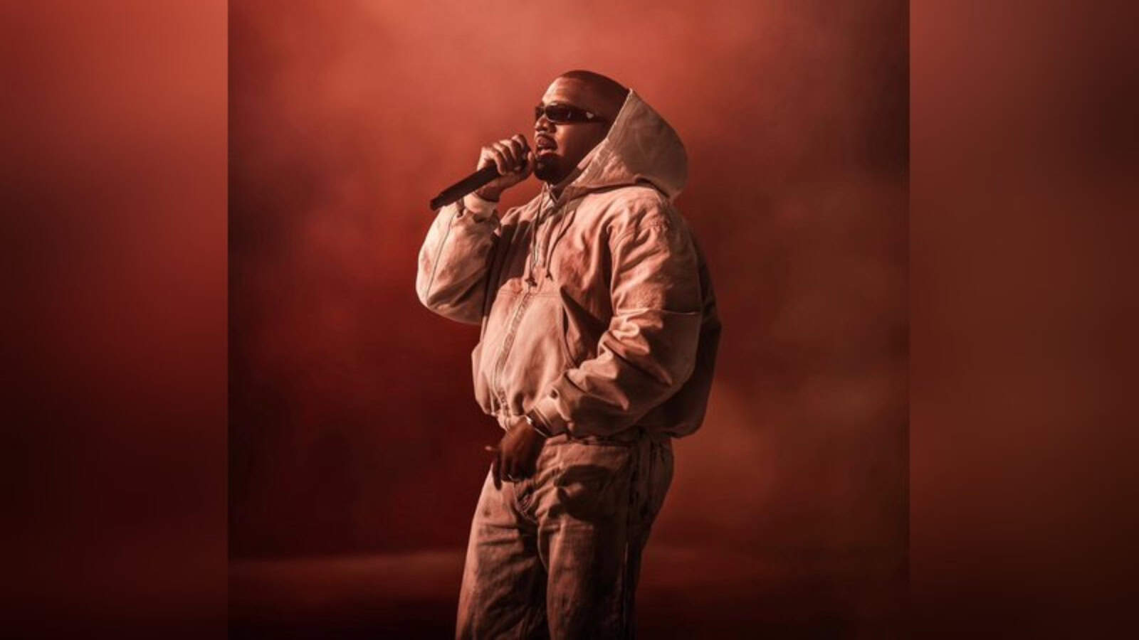 Kanye West on stage during his first-ever performance in India, showcasing his iconic style and musi.
