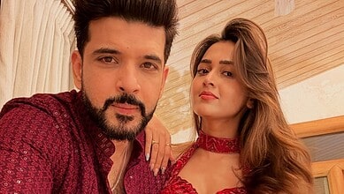 Prince Narula, Karan Kundrra, and Tejasswi Prakash pose together during a wedding event.