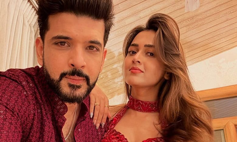 Prince Narula, Karan Kundrra, and Tejasswi Prakash pose together during a wedding event.