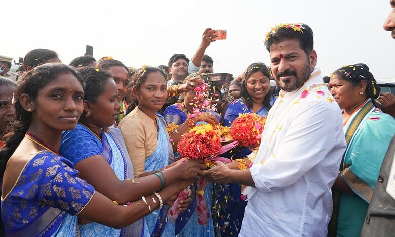Image showing Telangana CM Revanth Reddy interacting with the public.