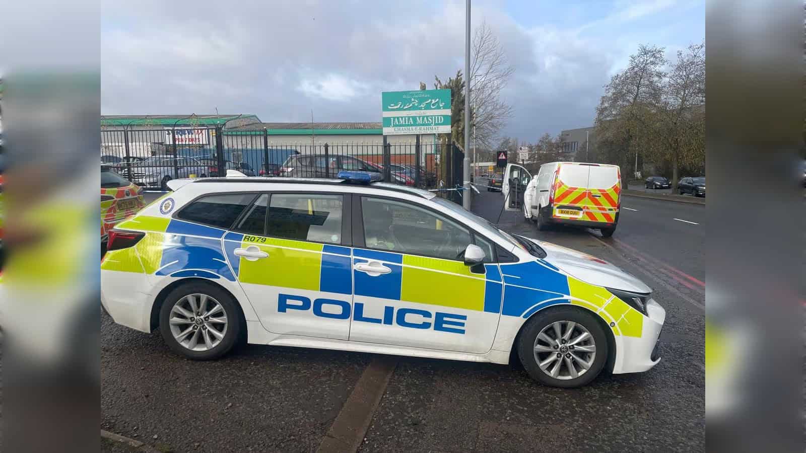 Police car and forensics van outside Oldbury Jamia Masjid in Smethwick, England, where an 18-year-old died after a stabbing.