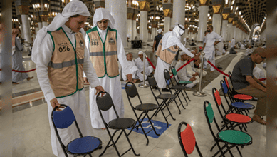Health workers performing COVID-19 testing at a mosque.
