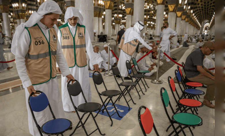 Health workers performing COVID-19 testing at a mosque.