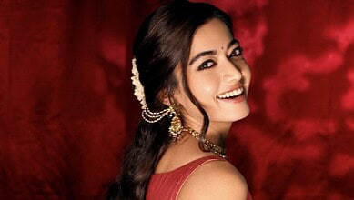 Rashmika Mandanna smiling in traditional attire, confirming her wedding news.