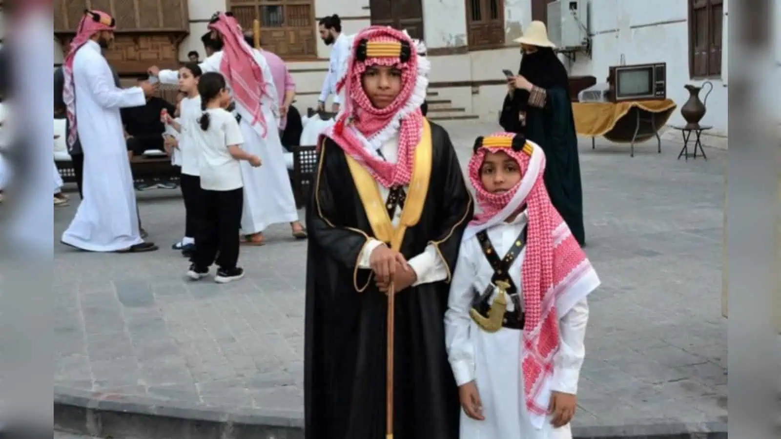 Saudi children in traditional dress celebrate Founding Day in Diriyah.