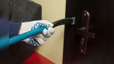 Man being arrested for stealing two mobile phones from a door lock.