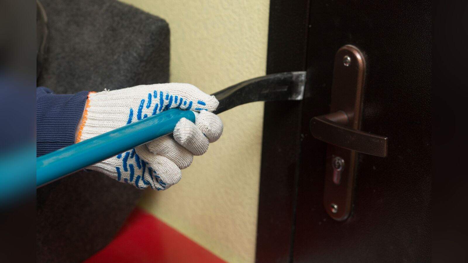Man being arrested for stealing two mobile phones from a door lock.