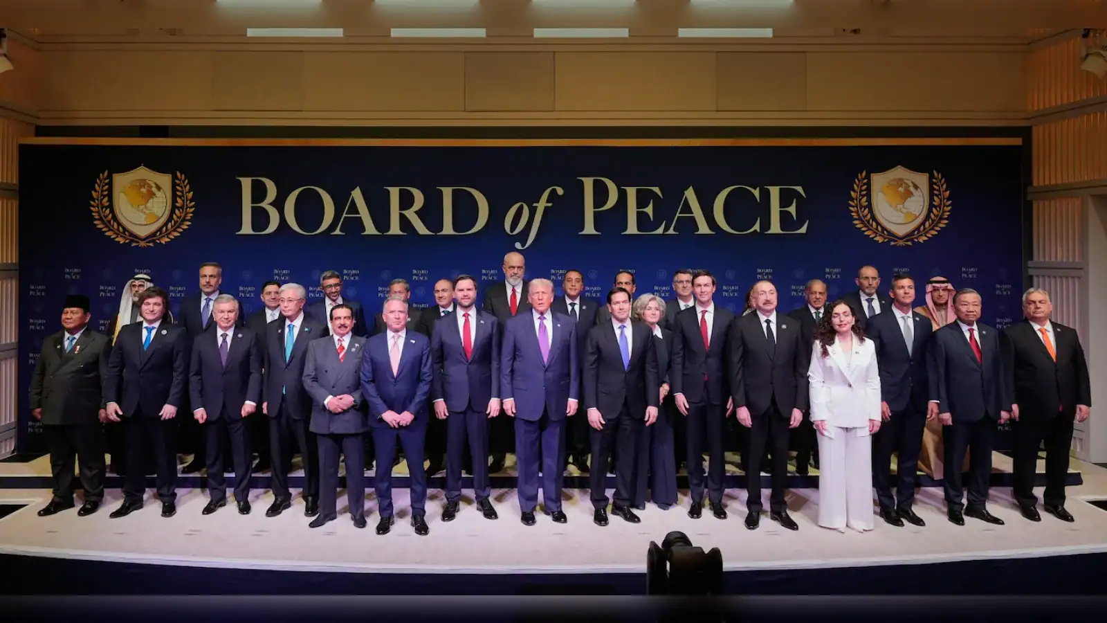 Group photo of officials and dignitaries at the Board of Peace event, showcasing leadership and collabora.
