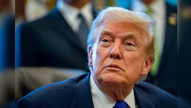 Donald Trump attending a political event, focused expression.