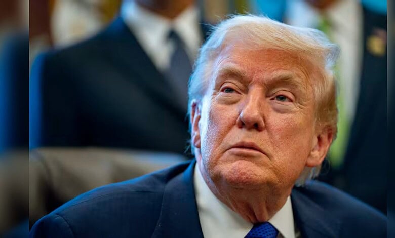 Donald Trump attending a political event, focused expression.