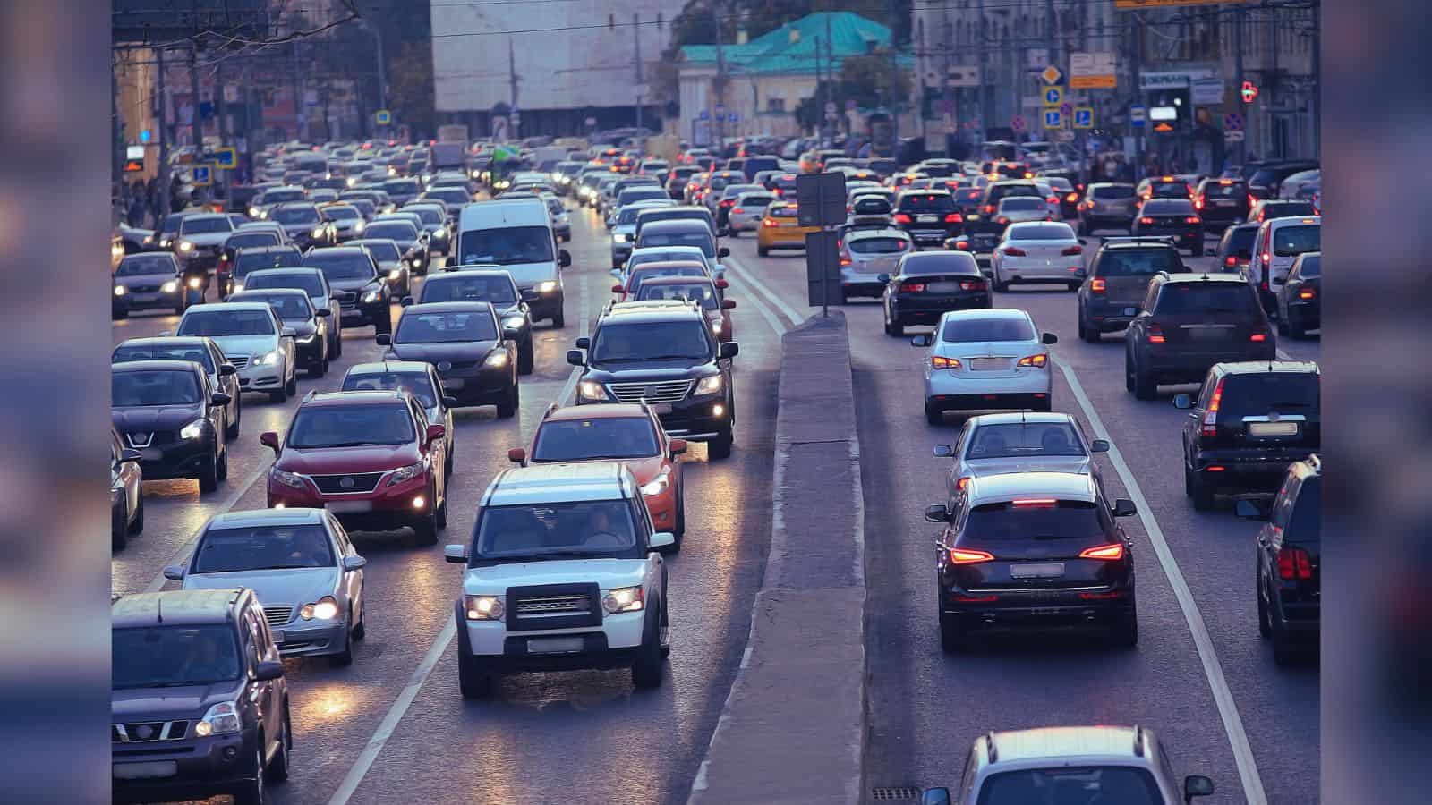 Traffic jam in Telangana with vehicles on the road, related to vehicle registration and road safety.