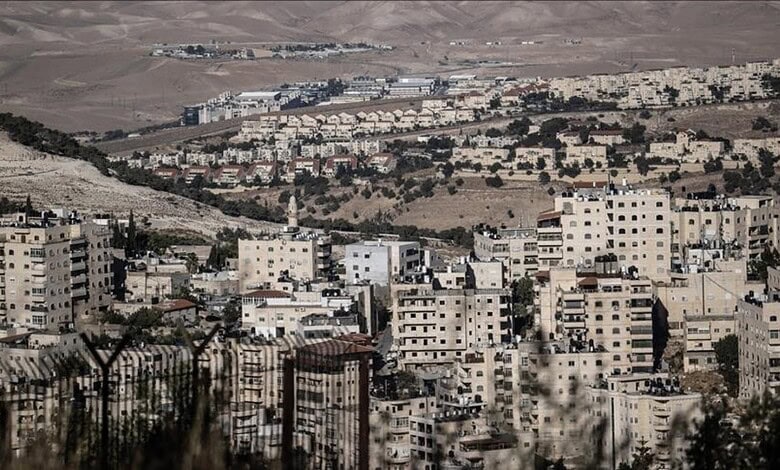 View of a densely populated Israeli settlement in the West Bank with residential buildings and surroundin.