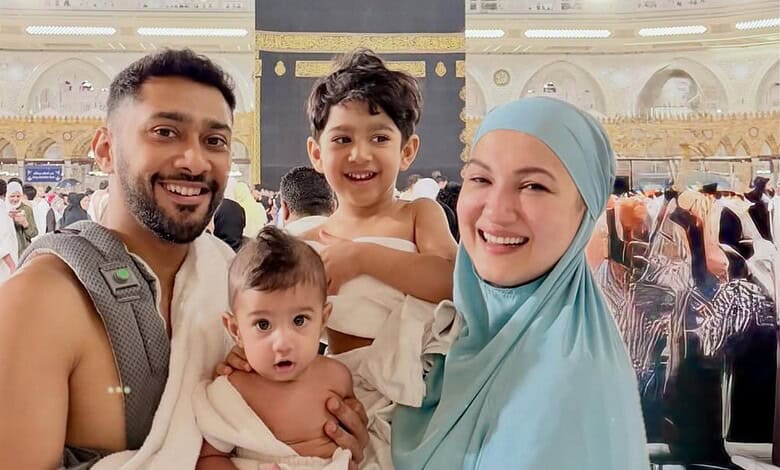 Gauahar Khan and her two sons at the holy Kaaba during Umrah, capturing a joyful moment of family devotio.