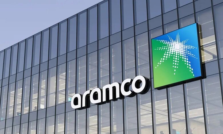 Modern Aramco office building with glass facade and company logo in Saudi Arabia.