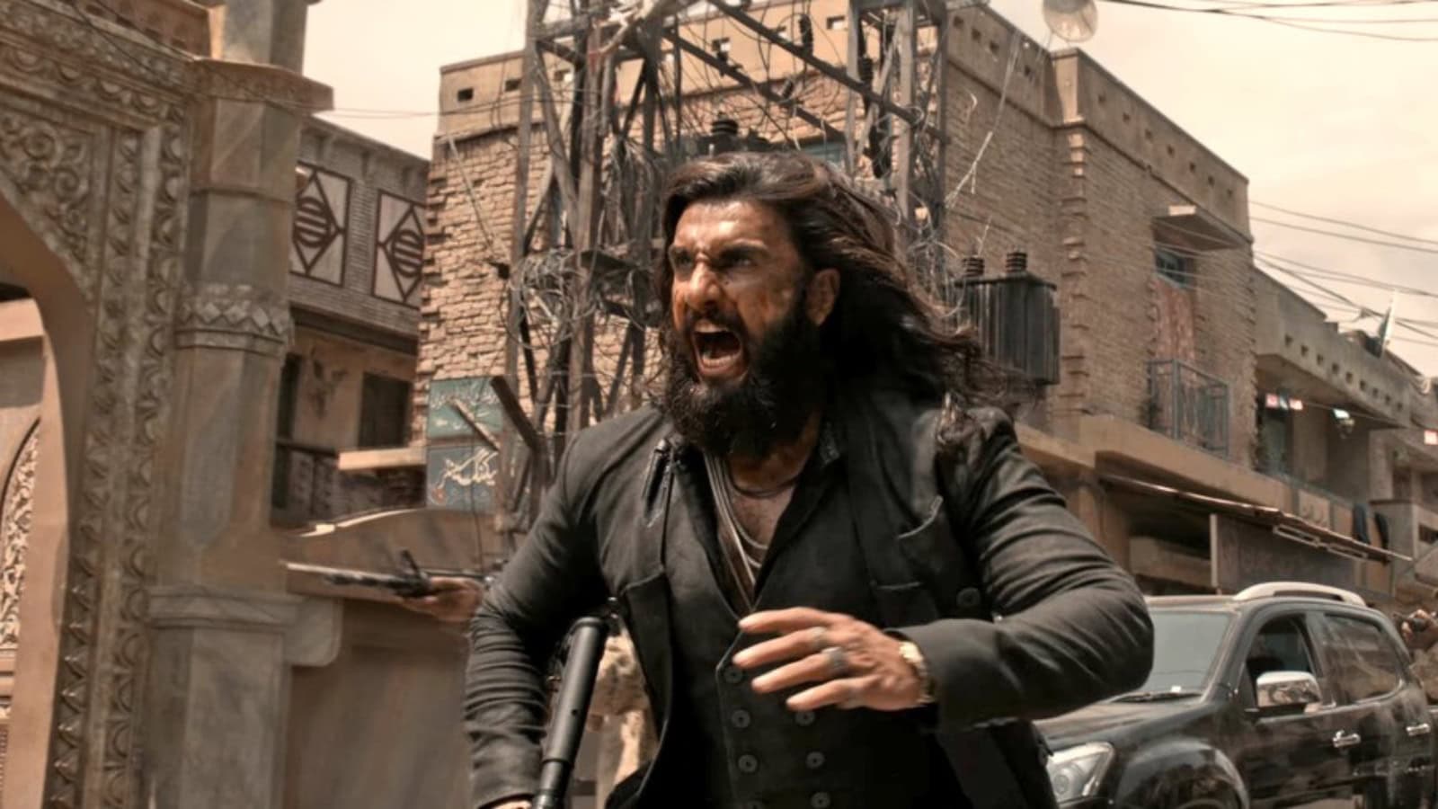 Dhurandhar 2 movie premiere in Hyderabad with intense action scene featuring a fierce character.