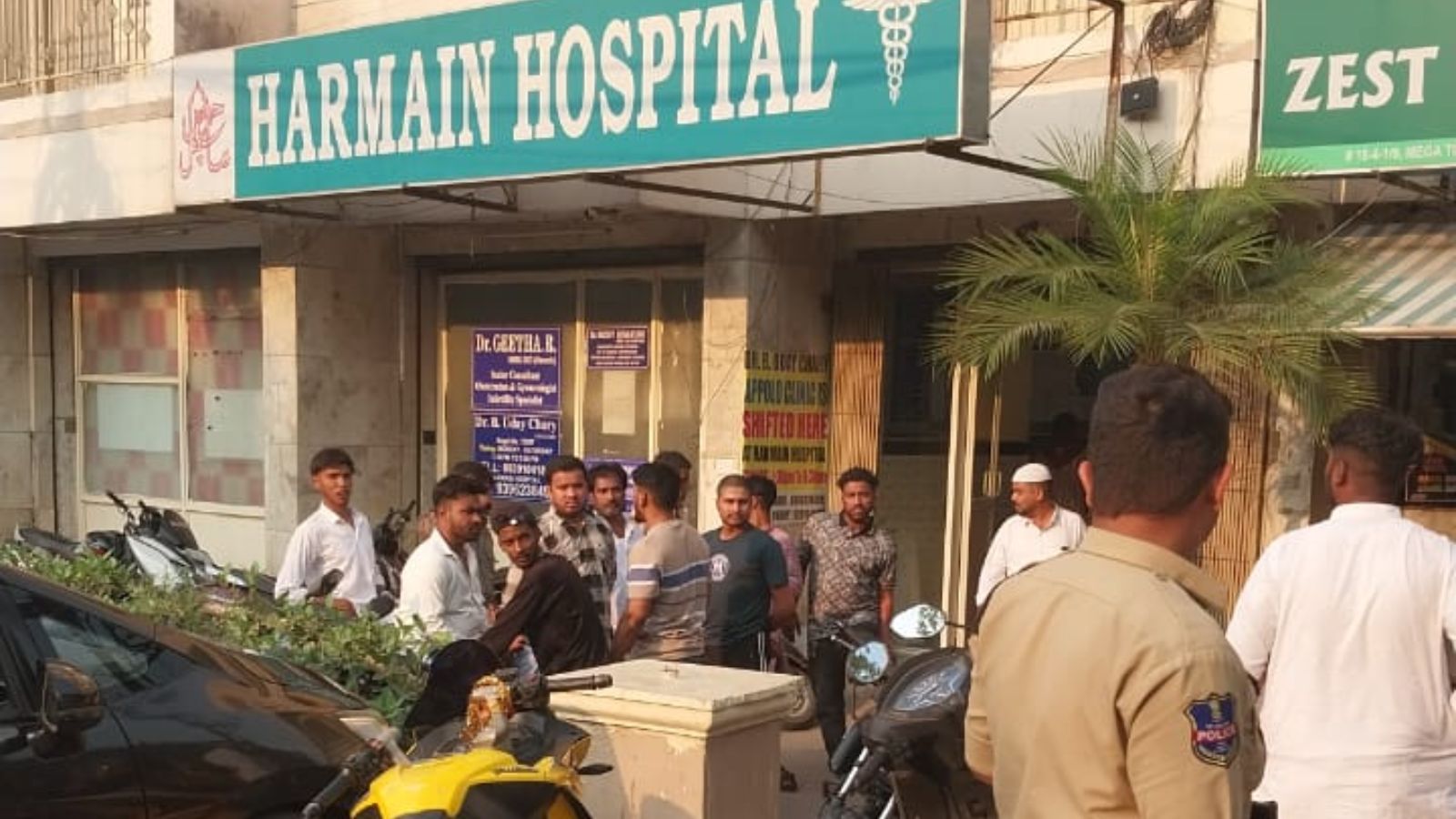The image shows friends of Syed Rizwan and police at Harmain Hospital in Falaknuma on Friday, March 27, 2026.