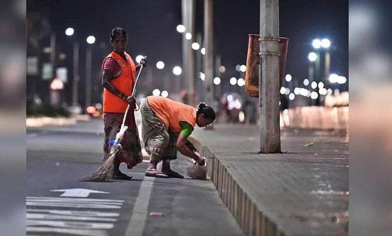 Group-I trainees cleaning streets during early morning sanitation in Hyderabad.