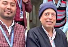 Group of journalists from Siasat Daily posing outdoors, smiling and wearing ID badges.