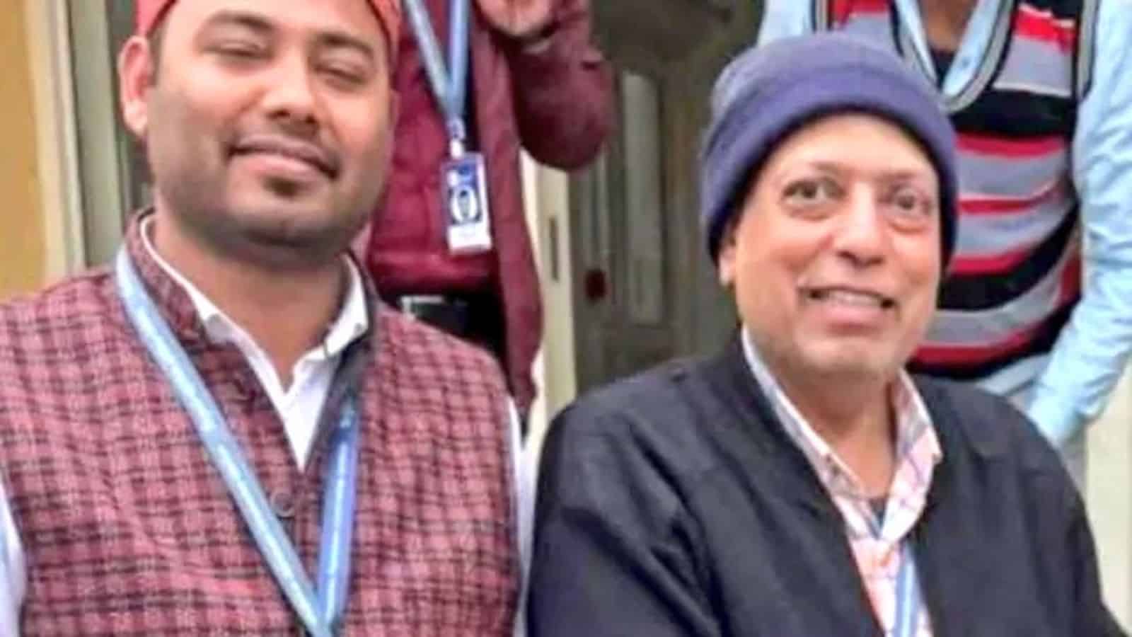 Group of journalists from Siasat Daily posing outdoors, smiling and wearing ID badges.