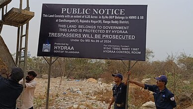 The image shows HYDRAA officials fencing 6.3 acre government land worth Rs 600 crore in Hyderabad's IT Corridor in Gandipet mandal of Rangareddy district on Monday, March 2, 2026.