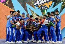India cricket team celebrating ICC T20 World Cup victory with trophy.