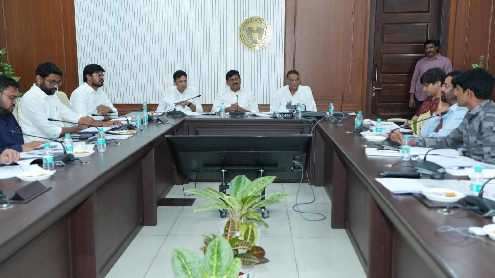 Telangana officials discuss housing policy in a formal meeting.