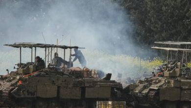 Israeli soldiers atop an APC in northern Israel near the border with Lebanon (Source AP)