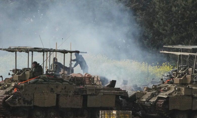 Israeli soldiers atop an APC in northern Israel near the border with Lebanon (Source AP)