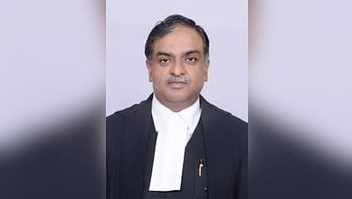 Indian judge in formal robes speaking about AI's role in legal training and judicial discipline.