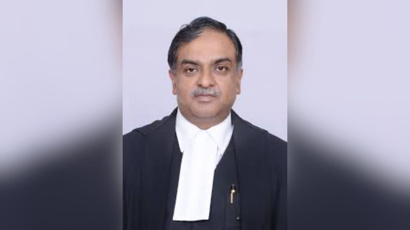 Indian judge in formal robes speaking about AI's role in legal training and judicial discipline.
