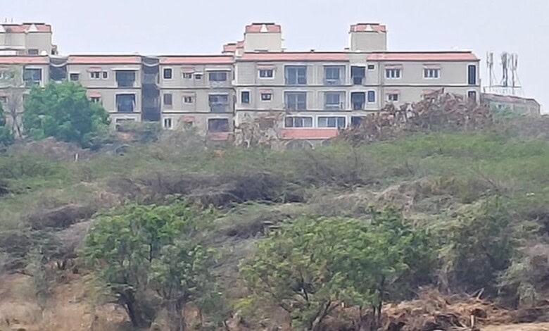 The image shows the view of Madhu Park Ridge apartments as seen from Bapu Ghat at Langar House on Tuesday, March 10.