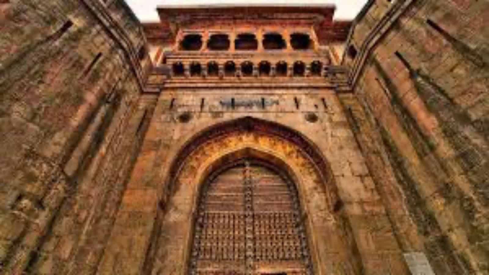 Ancient fort entrance at Mastani Mahal in Pune, showcasing Mughal architecture and rich history for visit.