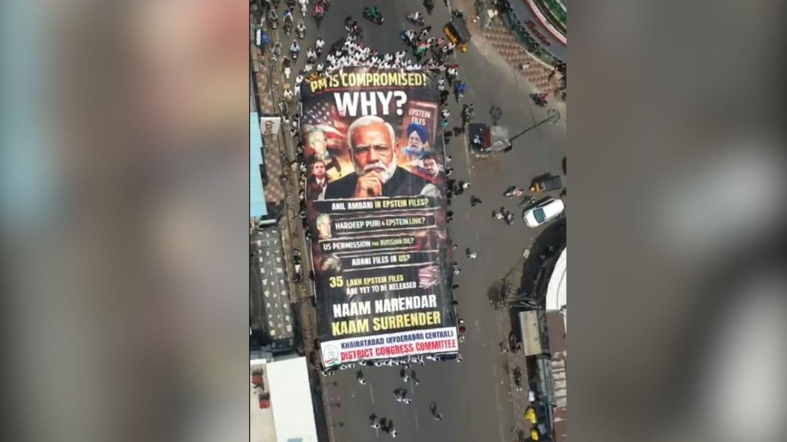 Large protest banner in Hyderabad criticising Narendra Modi, highlighting political issues and demanding accountability during a Congress protest.