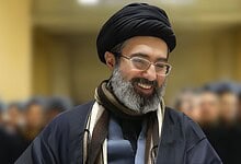 Mojtaba Khamenei, the new Supreme Leader, smiling during a formal event.