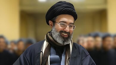 Mojtaba Khamenei, the new Supreme Leader, smiling during a formal event.