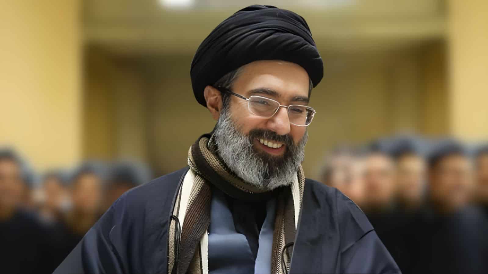 Mojtaba Khamenei, the new Supreme Leader, smiling during a formal event.