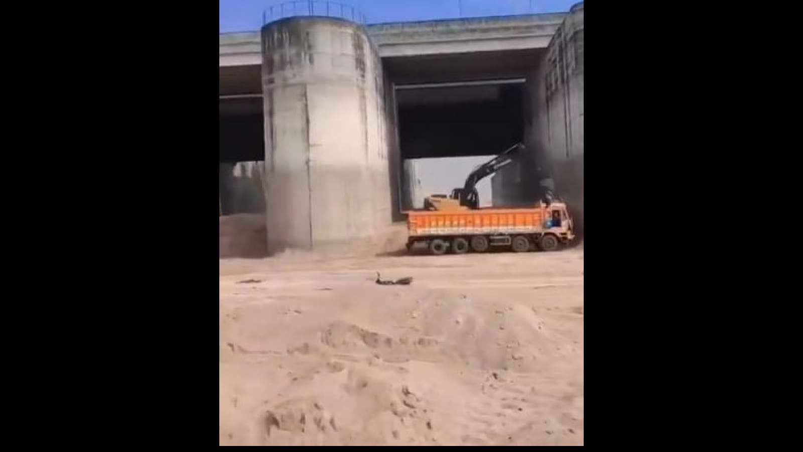 Heavy machinery engaged in sand mining under Telangana's Annaram barrage.