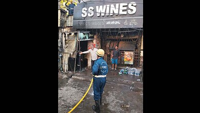 A fireman at work at SS Wines, Somajiguda