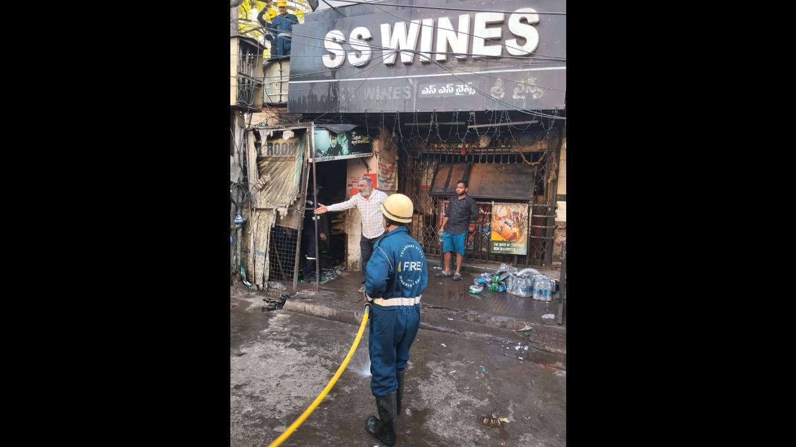 A fireman at work at SS Wines, Somajiguda
