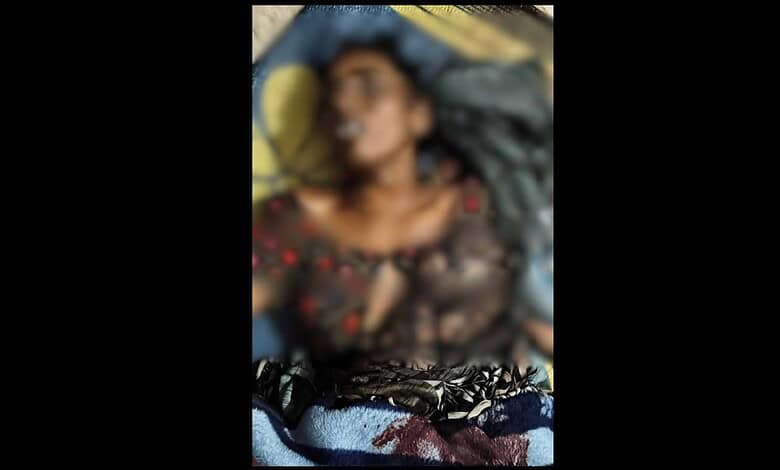 Woman injured on the ground following attack.
