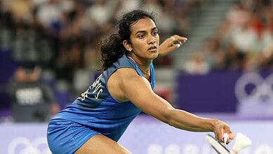 P V Sindhu preparing to serve during a badminton match at the Olympics.