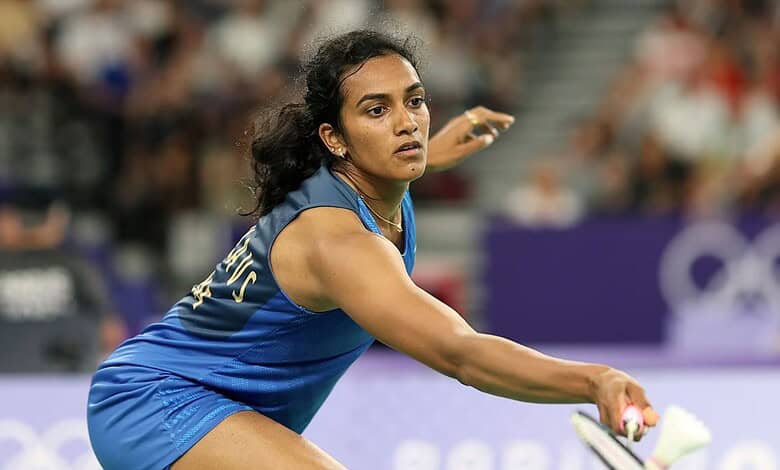 P V Sindhu preparing to serve during a badminton match at the Olympics.