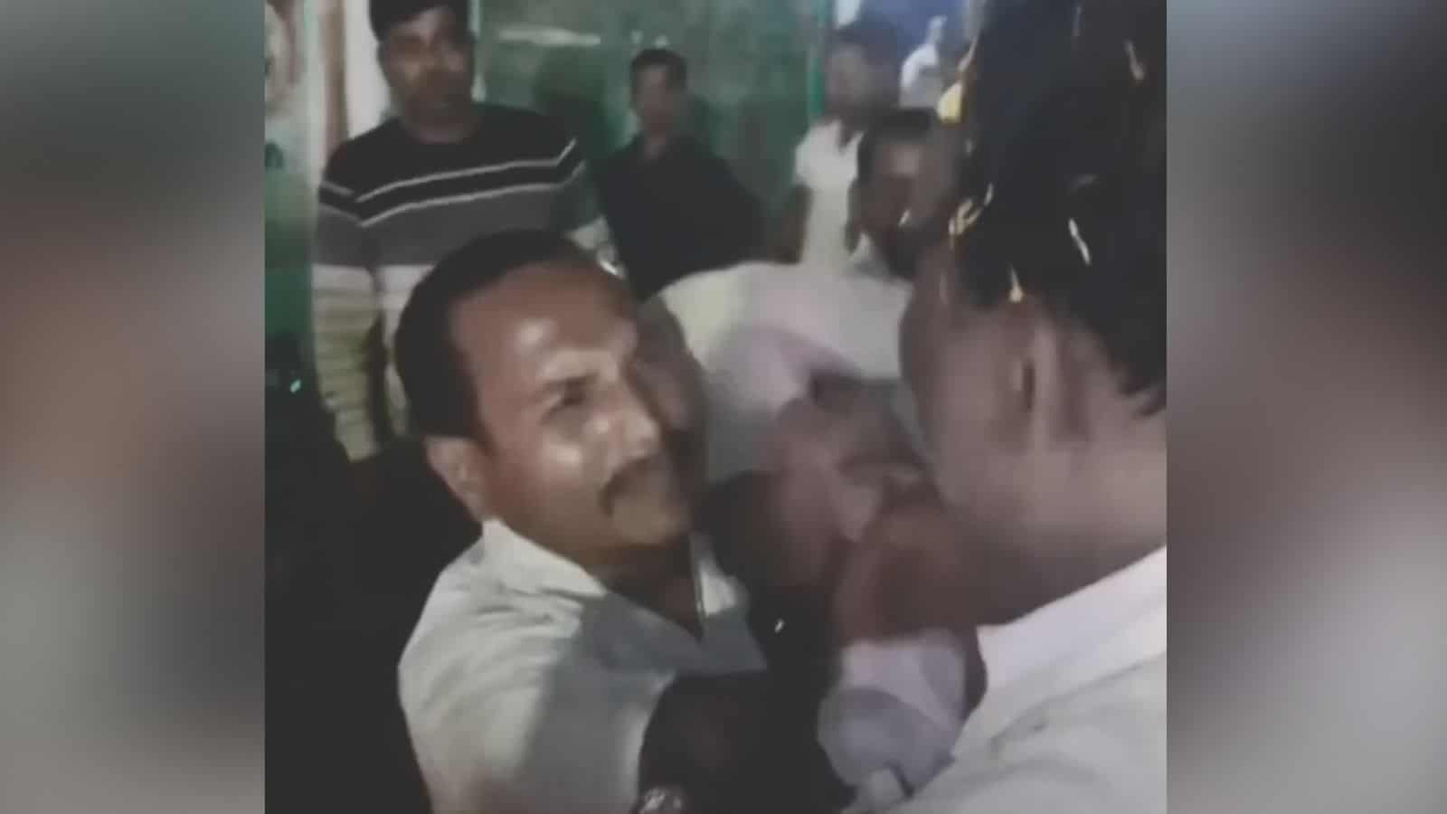 Clash between individuals during a viral non-veg photo incident at Kanpur temple, causing chaos and mob v.