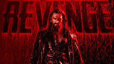 Intense scene from The Revenge featuring a man with long hair and beard in a rain-soaked setting.