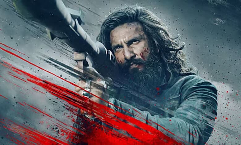 An intense scene from Dhurandhar 2 showing a fierce character aiming a weapon, highlighting the film's hi.