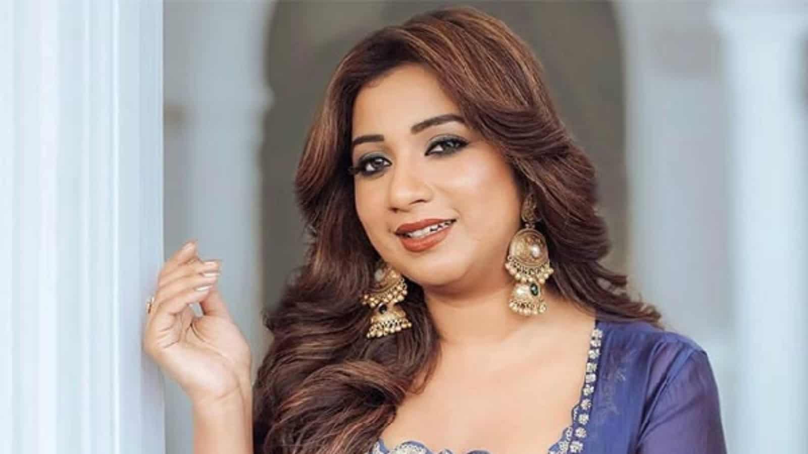 Shreya Ghoshal, a renowned Indian Idol singer, captured in a traditional outfit, highlighting her musical.