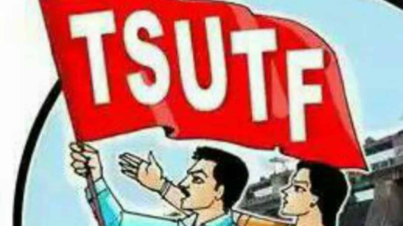 TSUTF rally in Hyderabad supporting KGBV and URS staff with participants holding a red flag.