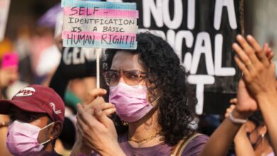 A member of the LGBTQIA+ community holds a placard during a protest against the passage of the Transgender Persons (Protection of Rights) Amendment Bill, 2026, in Parliament, at Azad Maidan in Mumbai on Wednesday, March 25.