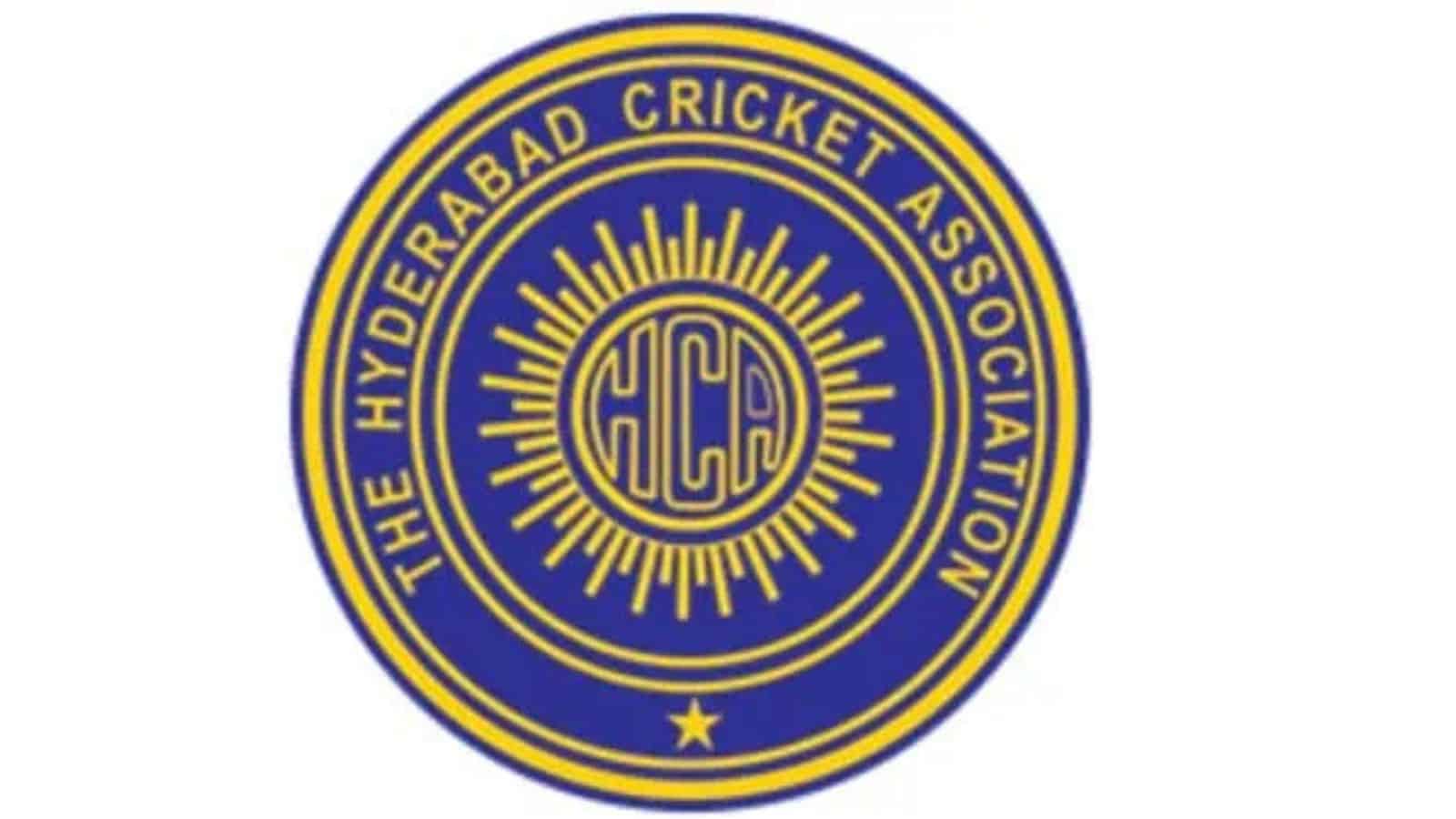 Hyderabad Cricket Association emblem with HCA initials and sunburst design.